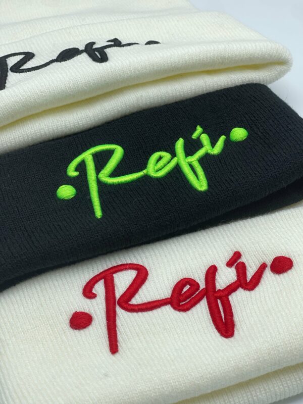 Three different colored RefiSnacks beanies with Refi on them up close
