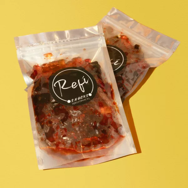 Two packs of Gummy bears coated in RefiSnacks chamoy paste
