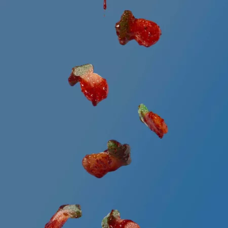 RefiSnacks chamoy paste covered Pineapple gummies falling from the top of the screen